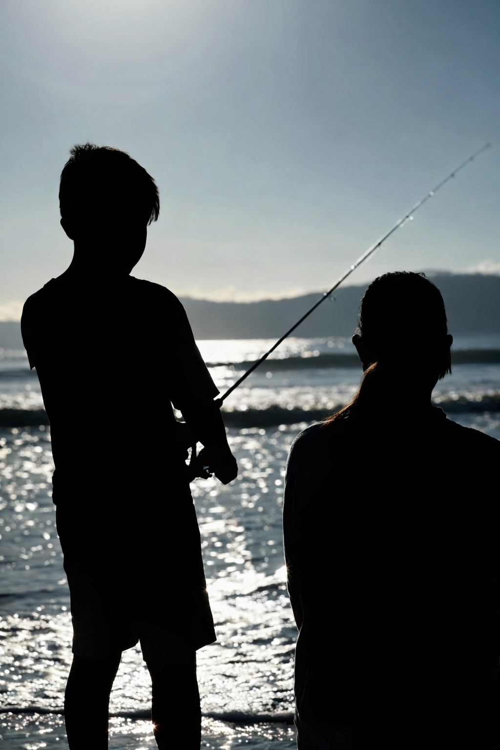 Family fishing silhouette
